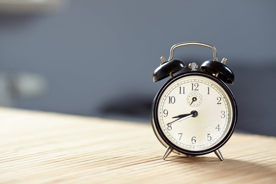 Photo of a retro alarm clock on a table