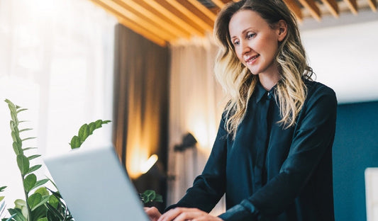 Photo of a beautiful woman working on laptop 